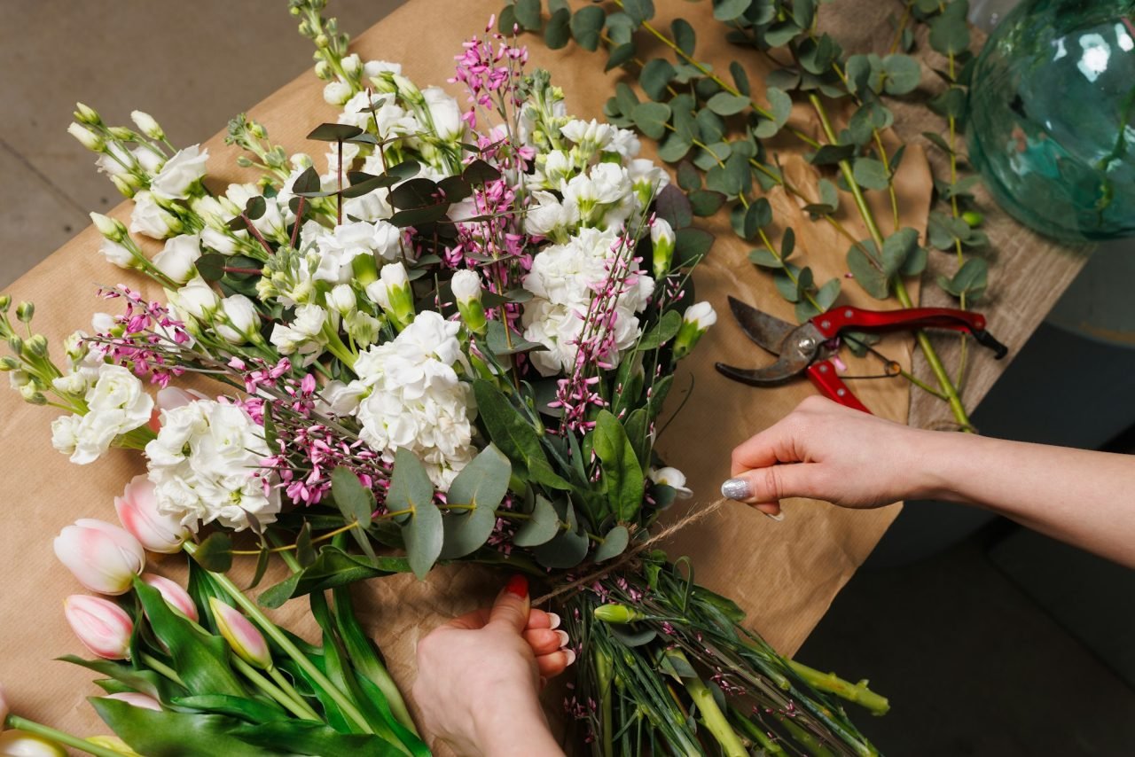 female-florist-makes-a-bouquet-in-a-flower-shop-spring-bouquet.jpg